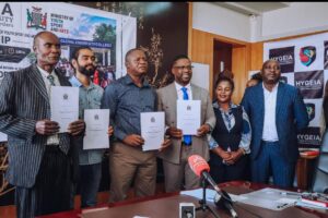 Minister of Youth, Sport and Arts Hon. Elvis Nkandu and Hygeia Global University College Principal Dr. Ignatius E. Chingangu signing an MoU for 20 fully funded youth scholarships in Lusaka.